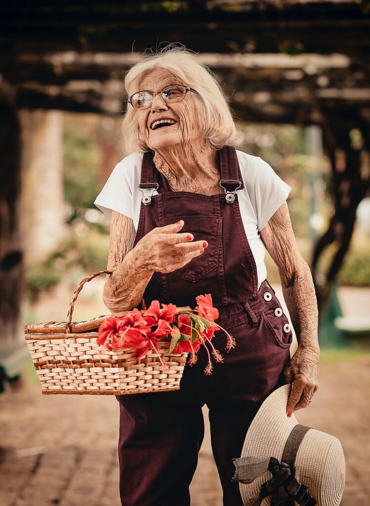 Signora con cesto di fiori. Gentle Care e Validation.